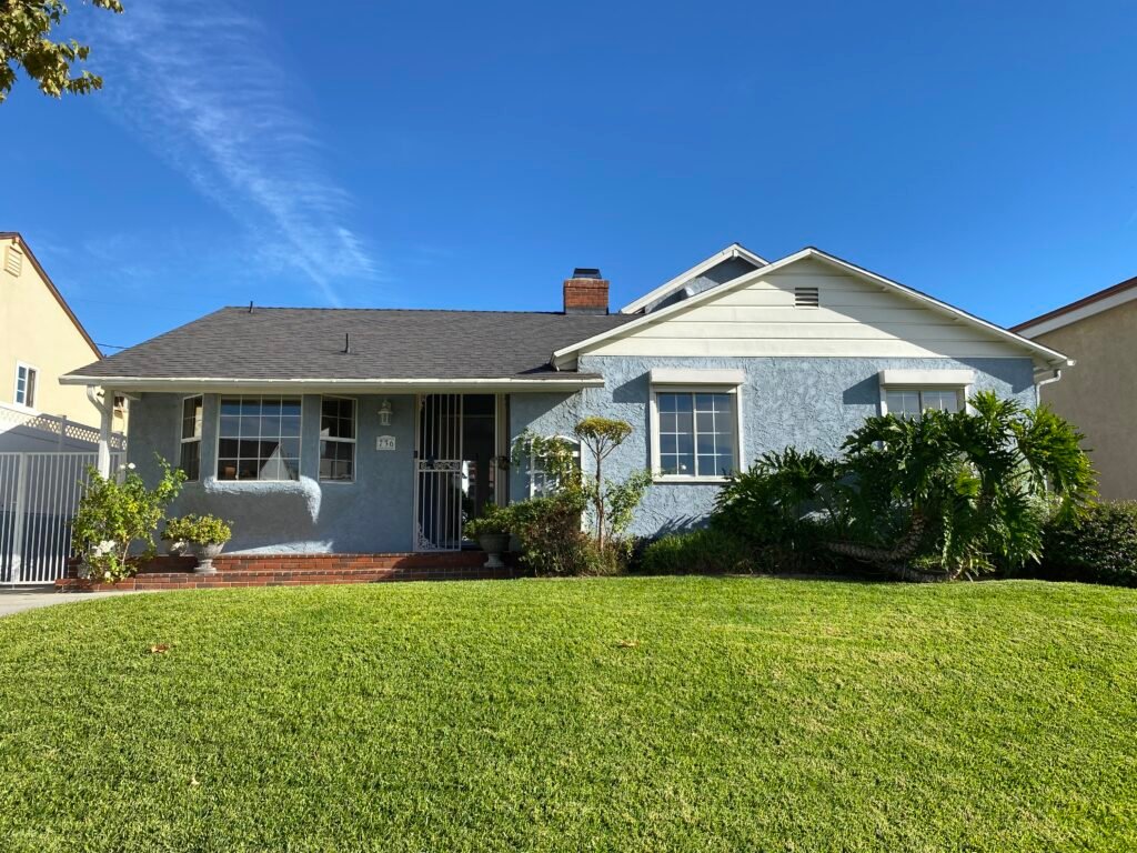 Front exterior of 736 Irving Drive Burbank Ranch Home with mature trees and classic single-story design.