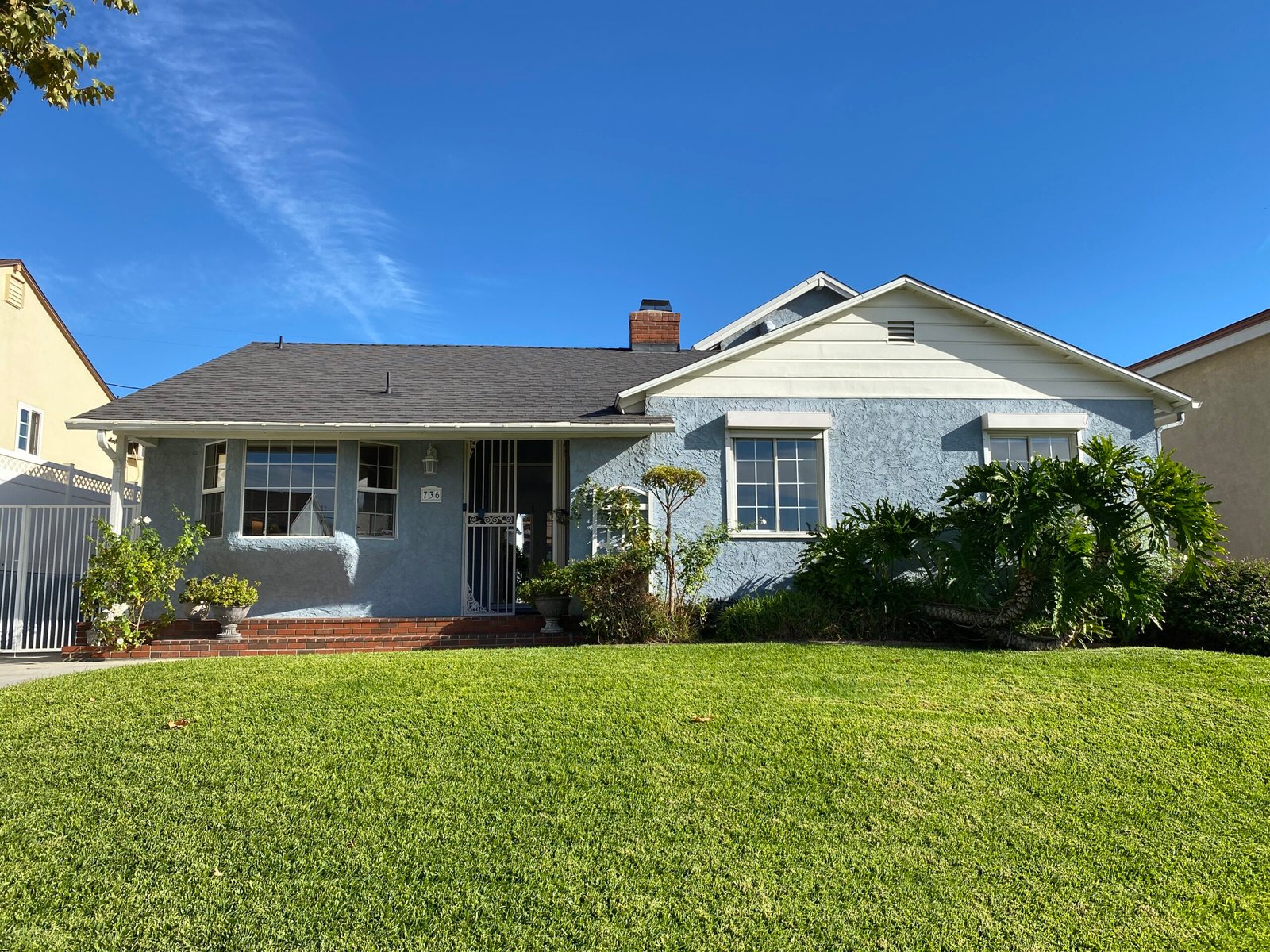 Front exterior of 736 Irving Drive Burbank Ranch Home with mature trees and classic single-story design.