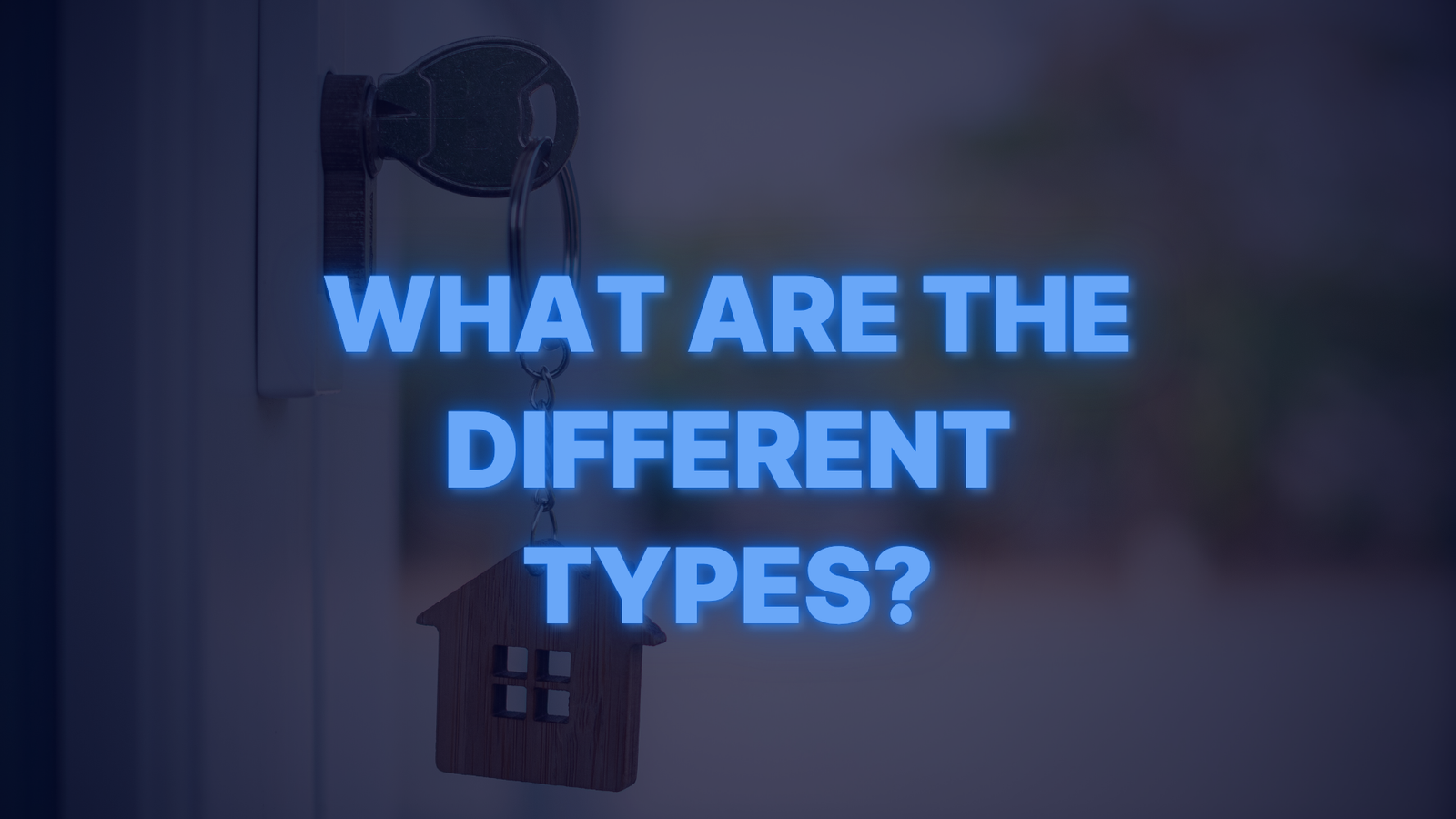 House key in a door with a home-shaped keychain symbolizing different types of conventional loans.