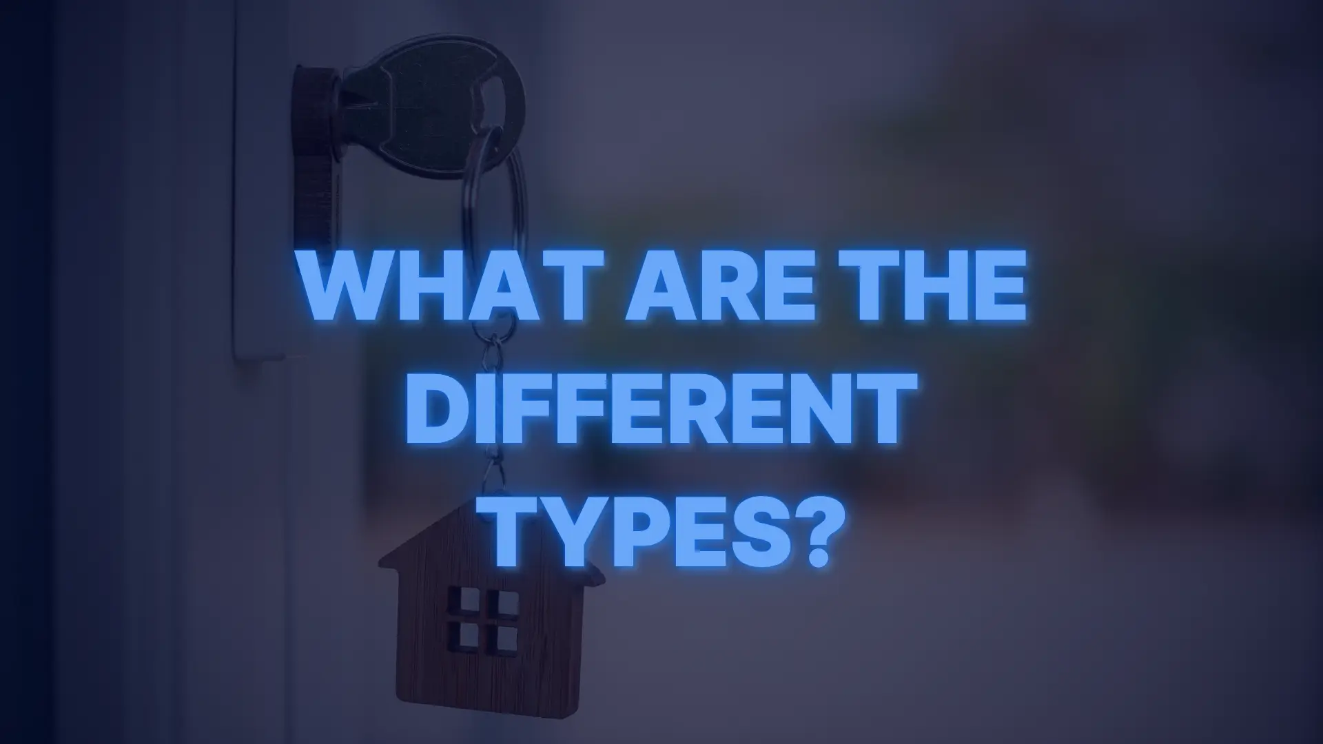House key in a door with a home-shaped keychain symbolizing different types of conventional loans.