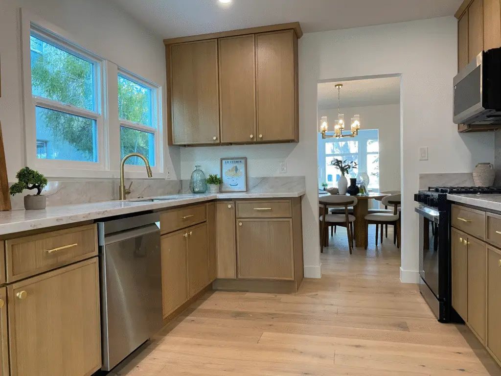 Updated kitchen in 1108 E Harvard Glendale Craftsman Home with stainless steel appliances and quartz countertops.